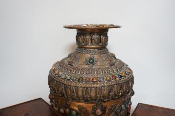 An early 20th century Tibetan hardstone mounted copper vase, Japanese porcelain cups and saucers and a pair of mahogany stands